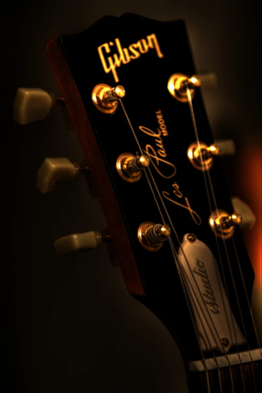 close up po of strings of a gibson guitar