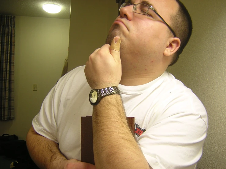 a man smoking a cigarette in a room