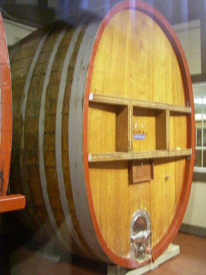 a wine barrel in the middle of the room