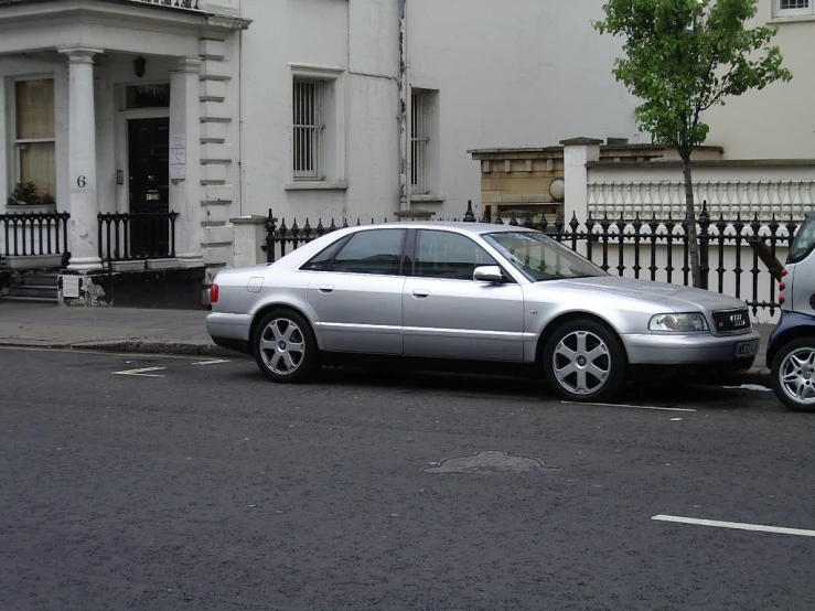 a silver car parked on the side of the road