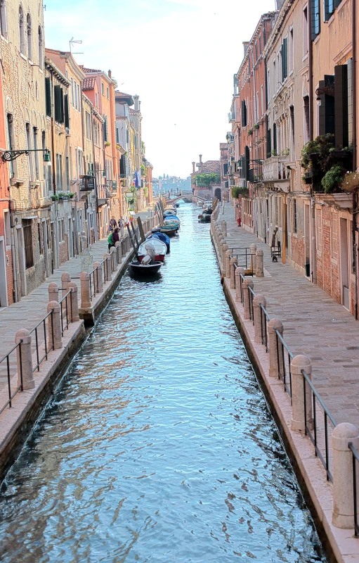 the city has beautiful canal water running between a lot of old buildings