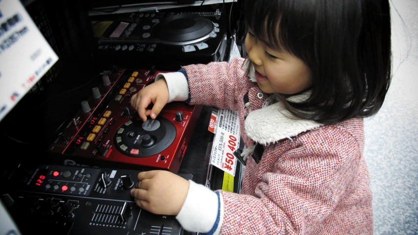 a small child playing a game with ons on the console