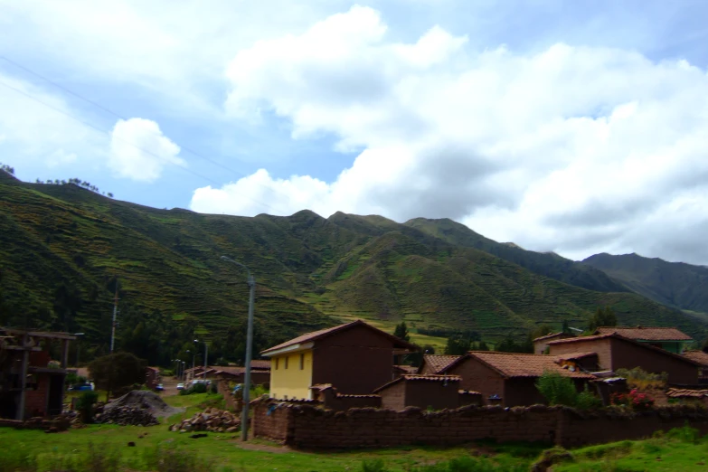 an area that looks like a village near some mountains