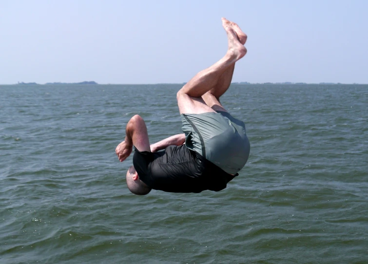 man flying through the air during water sports