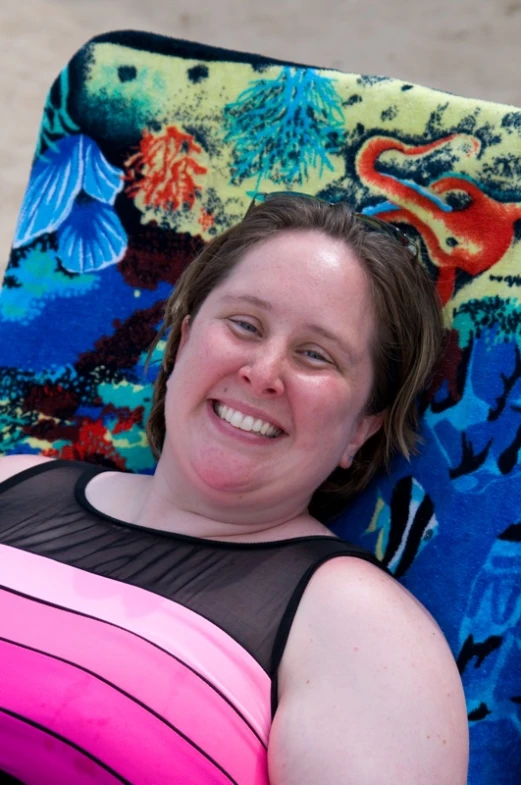 a women laying in an outdoor beach chair