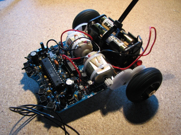 a close up of a small robot with electronics attached to it