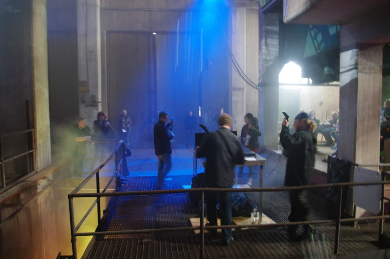 the people are standing on steps outside of an apartment building