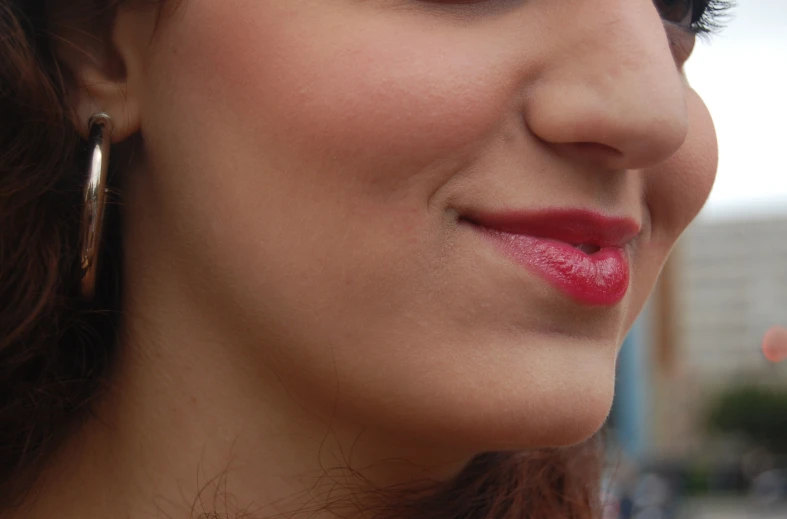 a closeup s of a woman's face with long shiny hair