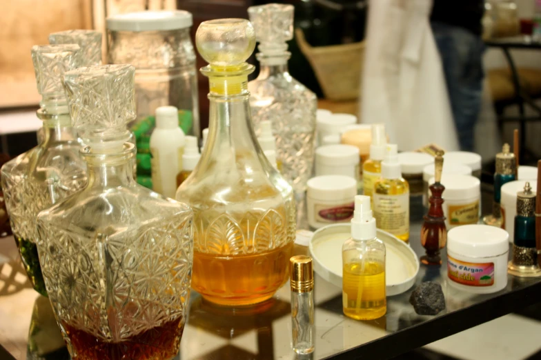 a number of bottles on a glass table