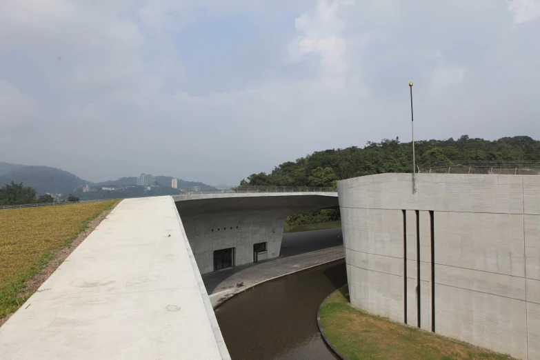 an elevated concrete walkway over a body of water