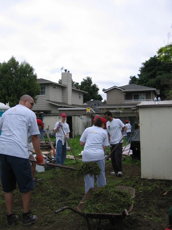 a group of people are in a yard