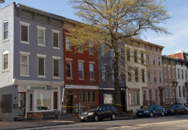 two large buildings line the streets of a street