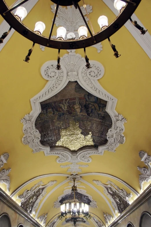 view of the ceiling of a yellow cathedral