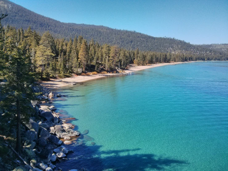 clear blue water and rocky coastline on the shoreline