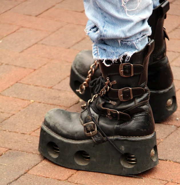 a person with chains and boots on the ground