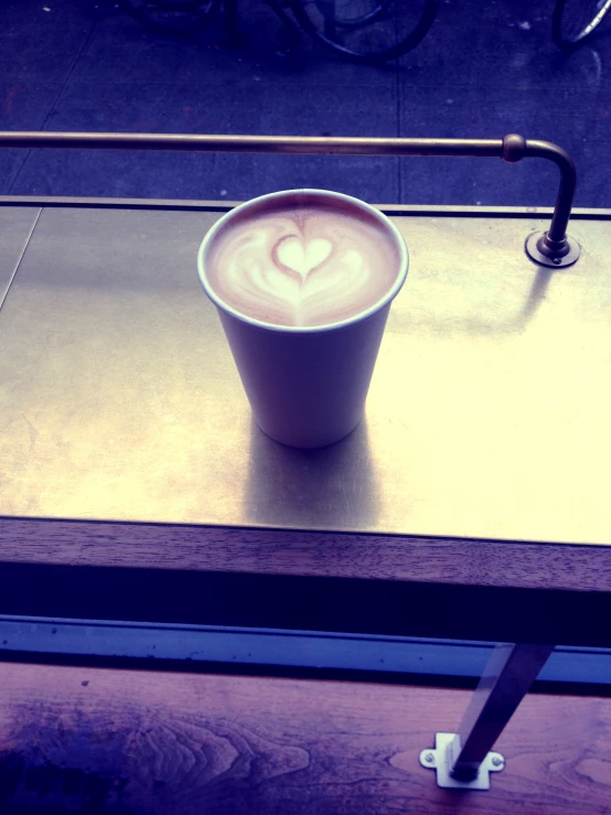 a cup with a heart shape drawn on it