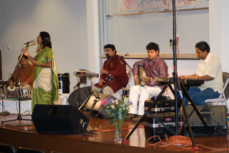 men playing on drums in front of a crowd