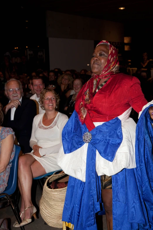 a man in traditional egyptian attire standing in a crowd