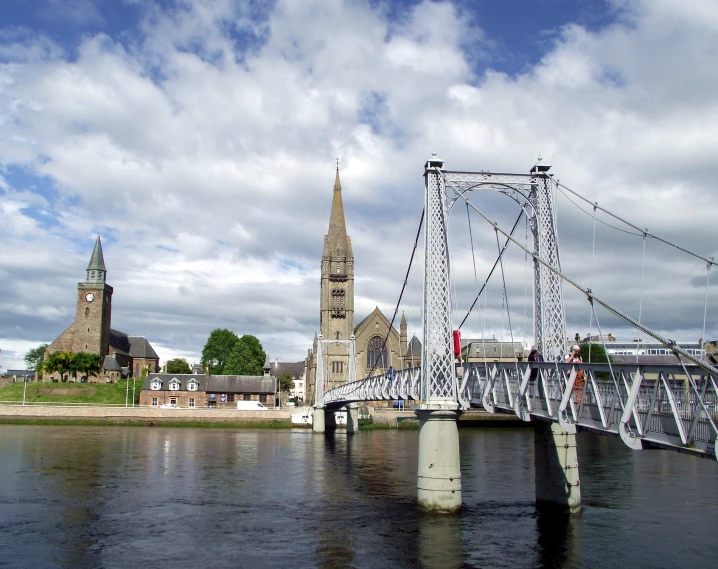 a view of the bridge that is across the water