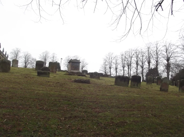 the cemetery with graves in the distance