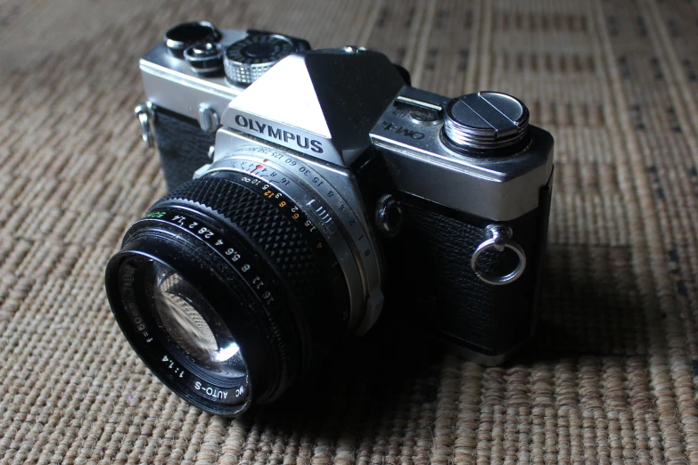 a camera sitting on top of a brown cloth