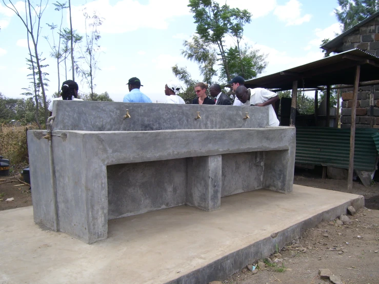 a large concrete bench that looks like a bus shelter