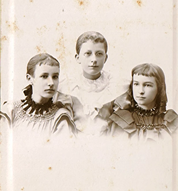 this is an old picture of three girls