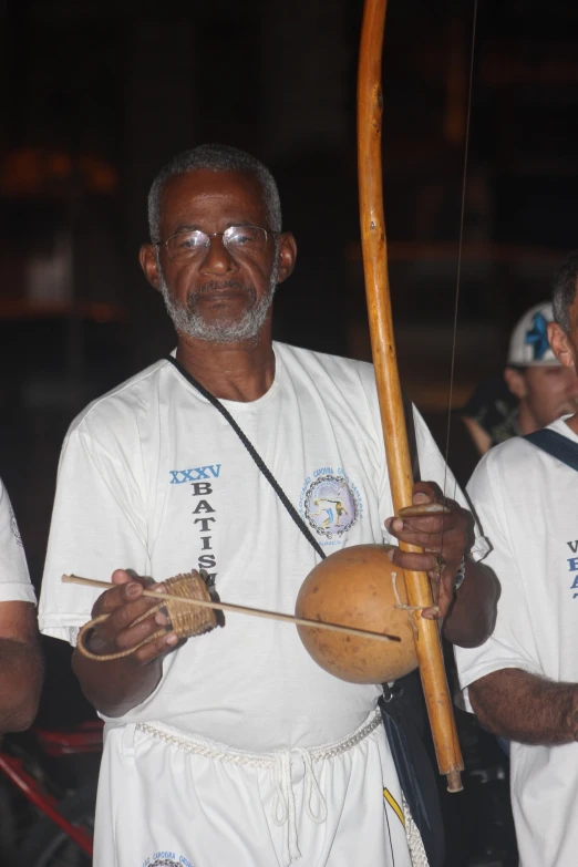 a man with an instrument playing a musical instrument