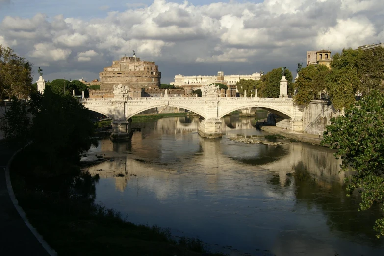 a small bridge crosses over a large body of water