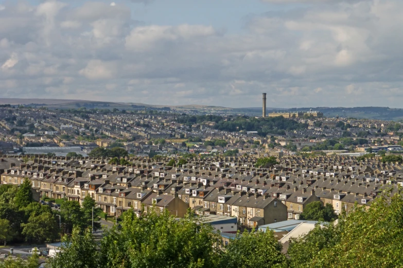 a city with lots of trees and buildings on top of it