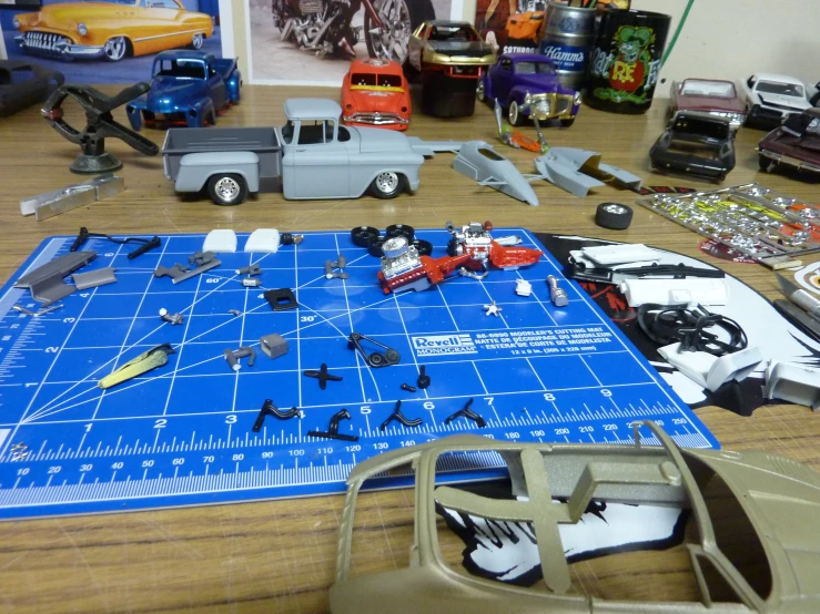 a large table top with assorted model trucks on it