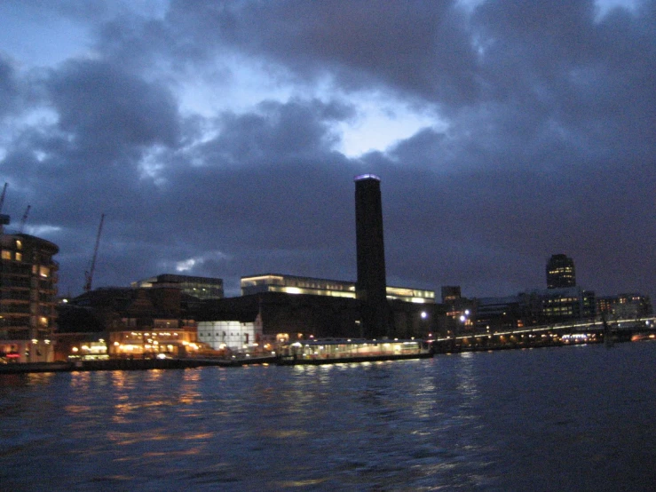 the harbor is crowded with boats at night