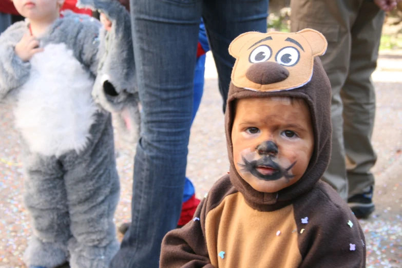 there is a child in a bear costume on