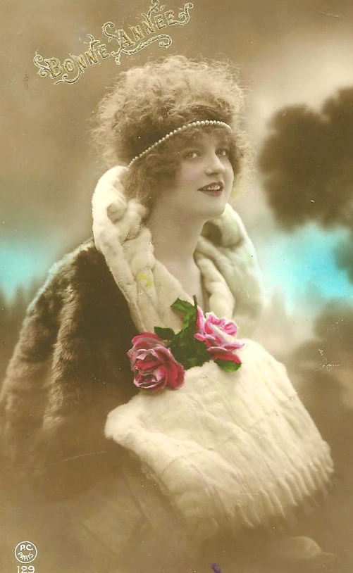 an old fashioned pograph of a woman with flowers