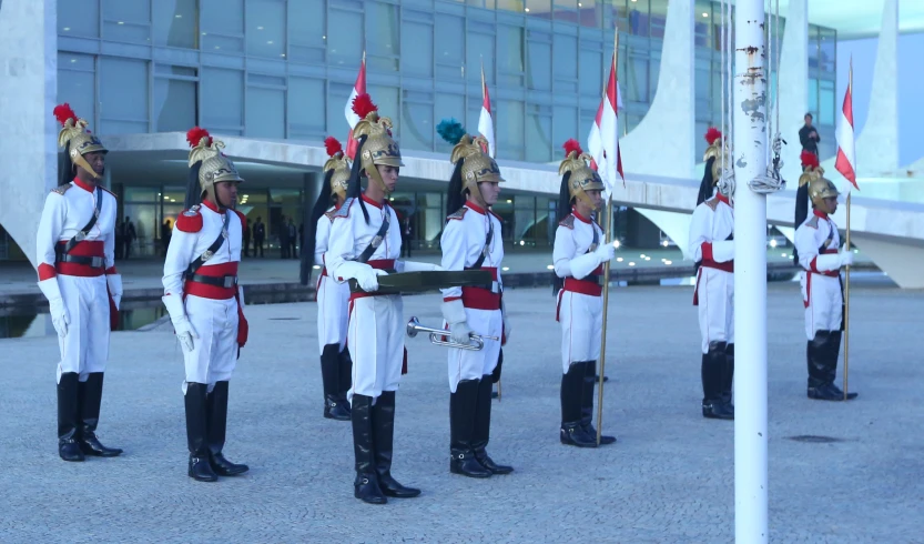 a line of guards standing in front of a building