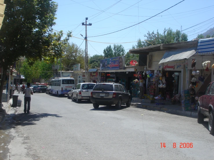 several cars parked on the side of a street