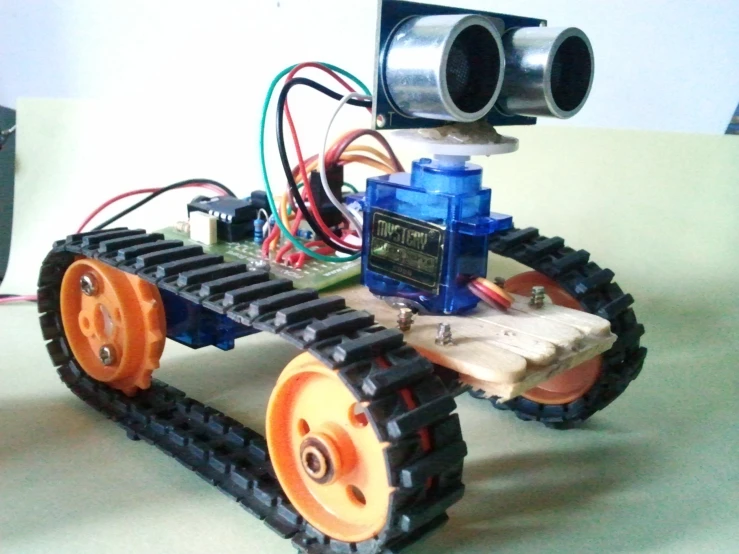 a little robot car that is made from parts
