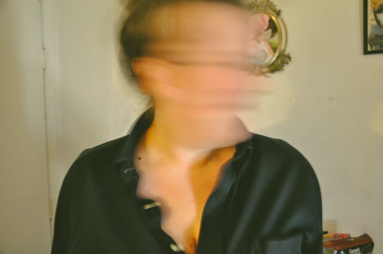a blurry image of a person holding soing