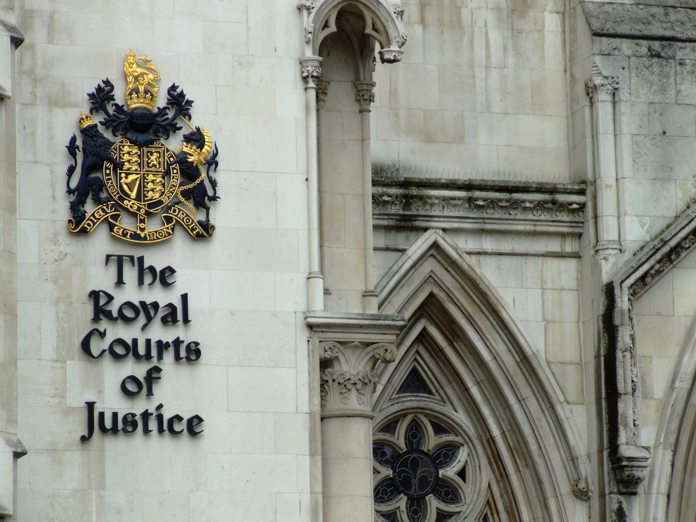 a large cathedral with the royal court of justice emblem on it