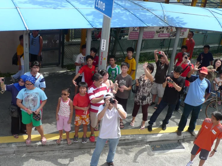 a person holding up his camera and posing for a picture