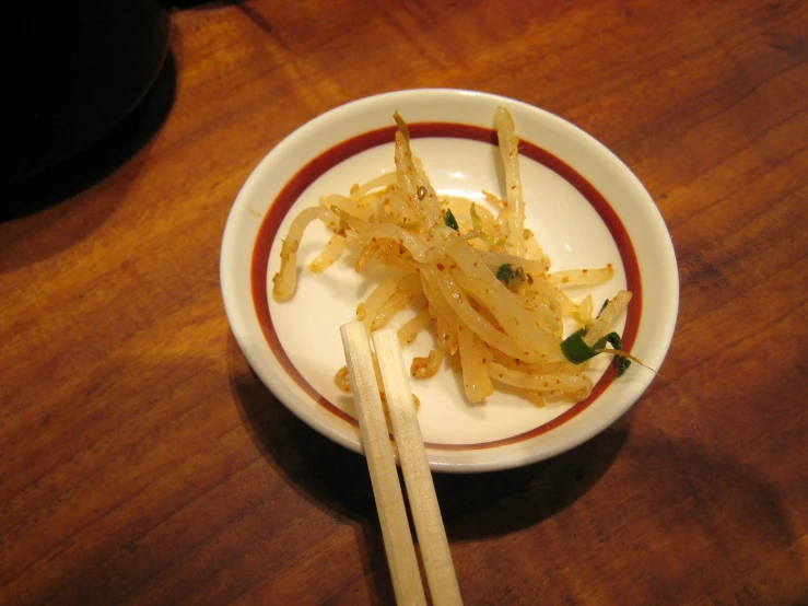 a white bowl filled with chopped up food