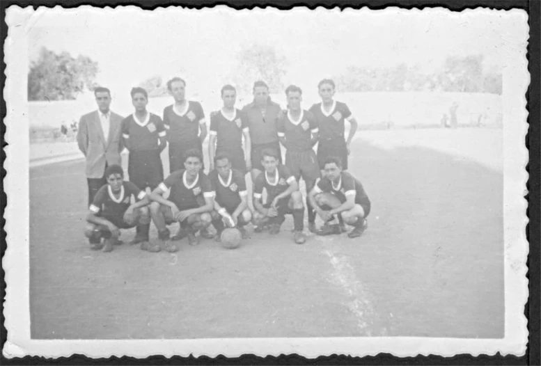 an old black and white po of a team of soccer players