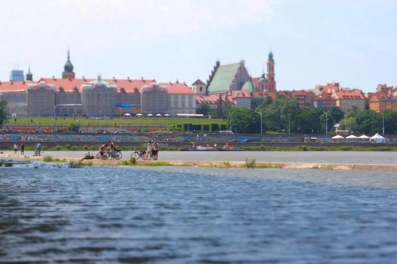 many people are enjoying the day by the water