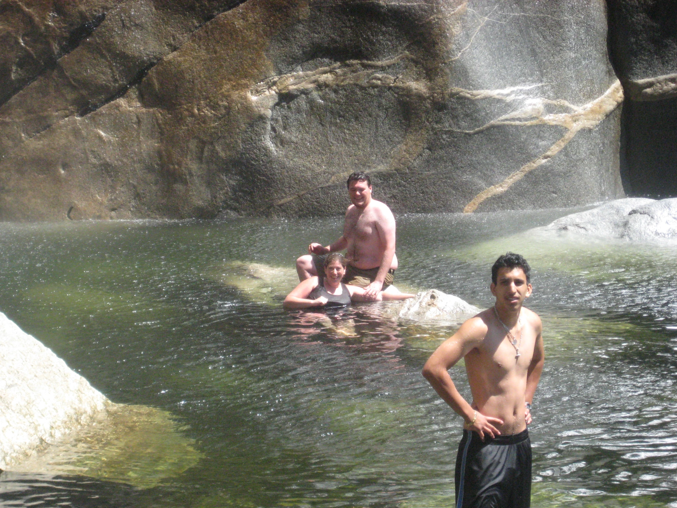 the men are having a lot of fun in the pool