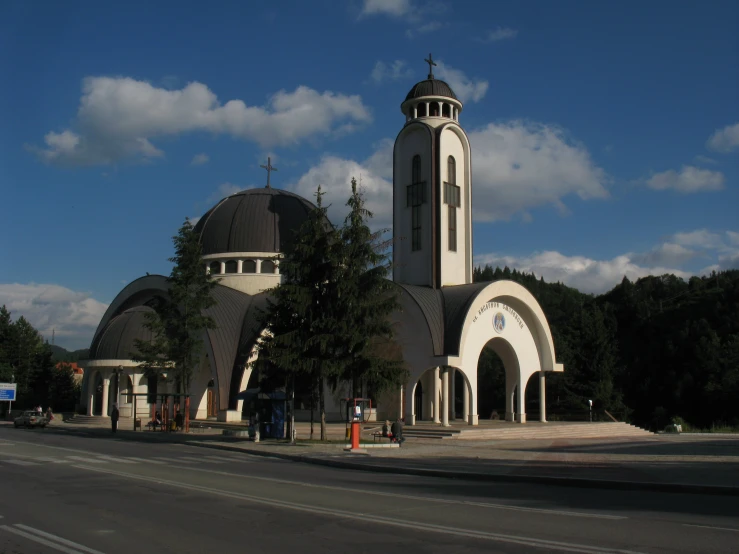 a large white church with domes and steeples on it