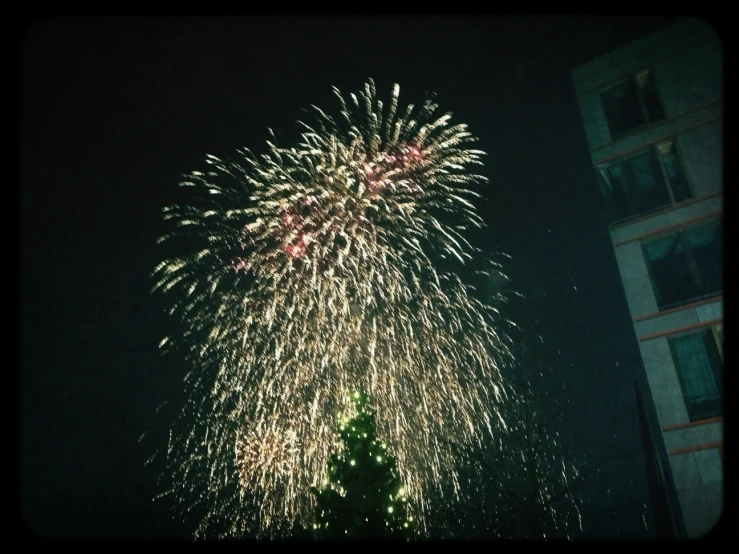 a beautiful display of fireworks during a black night