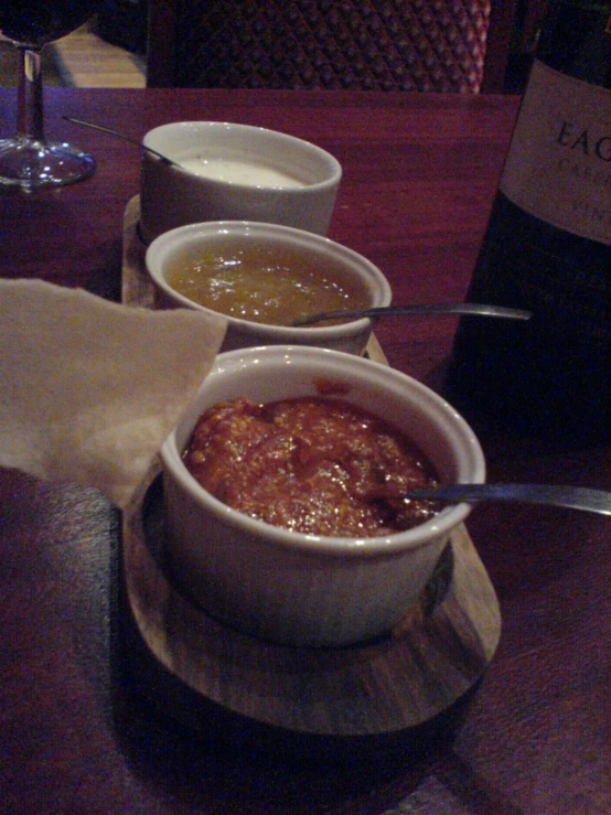 three bowls sitting on top of a table