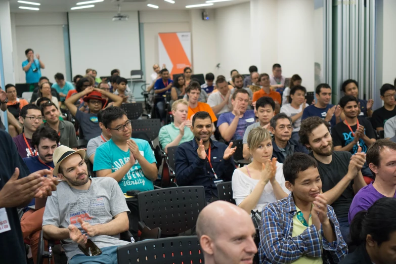 a large crowd is watching soing while a speaker