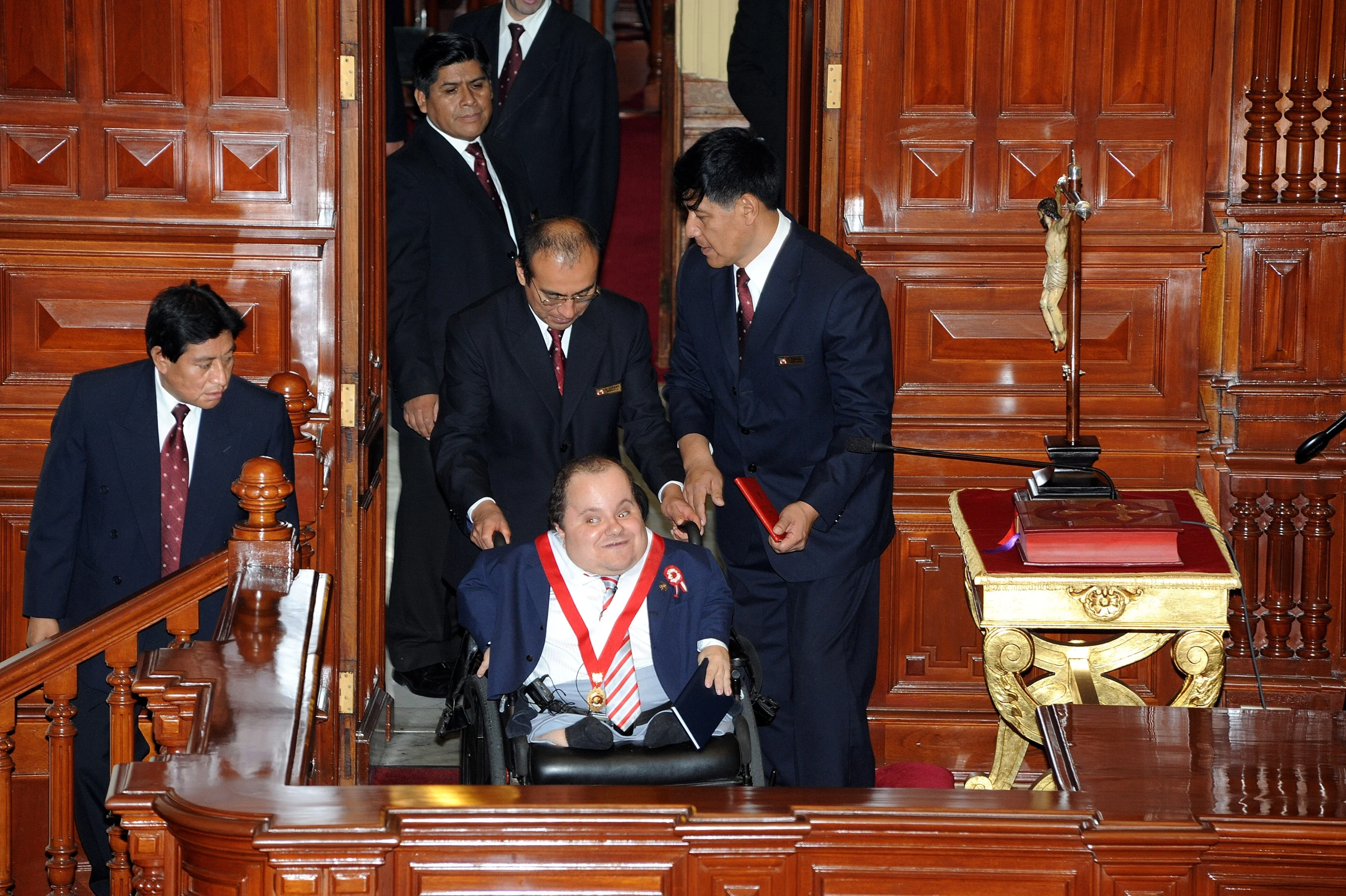 some business men are standing around in suits