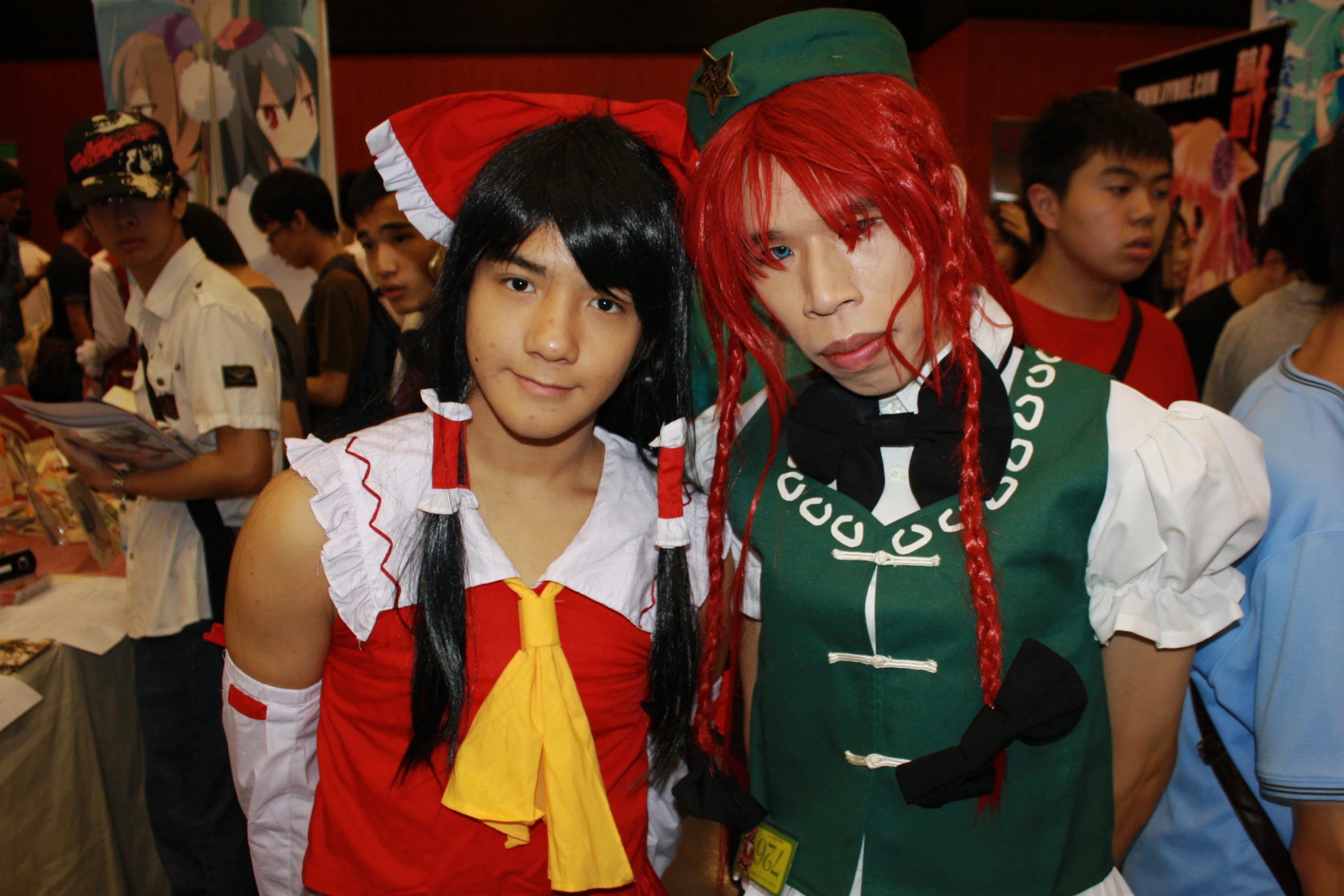 two women dressed in costumes pose for a po